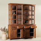 Open door image of a two-part showcase cabinet made from reclaimed teak wood, featuring glass-panel upper doors for display, four drawers for storage, and lower cabinets with solid wood doors in a natural finish.