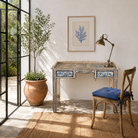 Lifestyle image of a Pranay hand painted reclaimed wood desk with blue and white floral motifs and two drawers 114cm