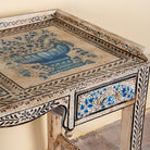 Close up image of a Pranay hand painted reclaimed wood desk with blue and white floral motifs and two drawers 114cm