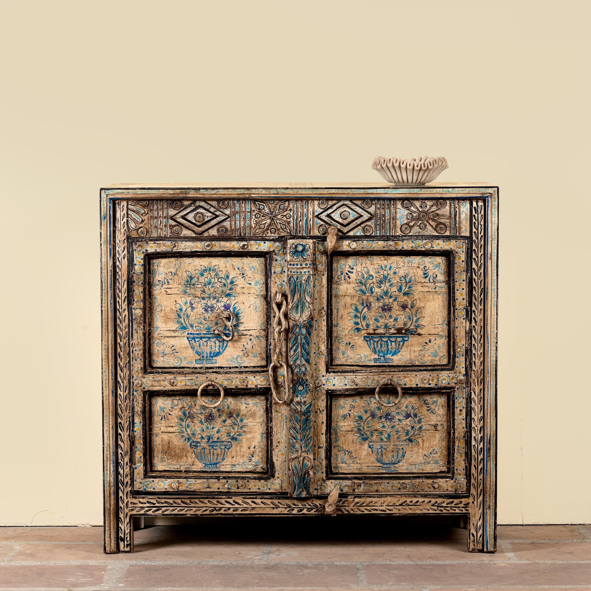 Prithvi reclaimed wood cabinet with original Indian doors and hand-painted blue and white floral design.