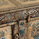 Close up image of a Prithvi reclaimed wood cabinet with original Indian doors and hand-painted blue and white floral design.
