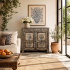 Lifestyle image of a Prithvi reclaimed wood cabinet with original Indian doors and hand-painted blue and white floral design.