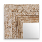 Close up image of a vintage mango wood mirror with hand-carved frame; rectangular wall mirror, 76 × 102 cm.