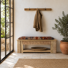 Lifestyle image of a Purna reclaimed teak wood bench with hand carved Indian house elements and lower shelf 160cm