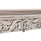 Close up image of a Raj Heritage Coat Rack handcrafted from an antique Indian reclaimed wood architectural element with intricate hand-carved floral details, bleached finish and seven iron hooks, 150x7x5cm.