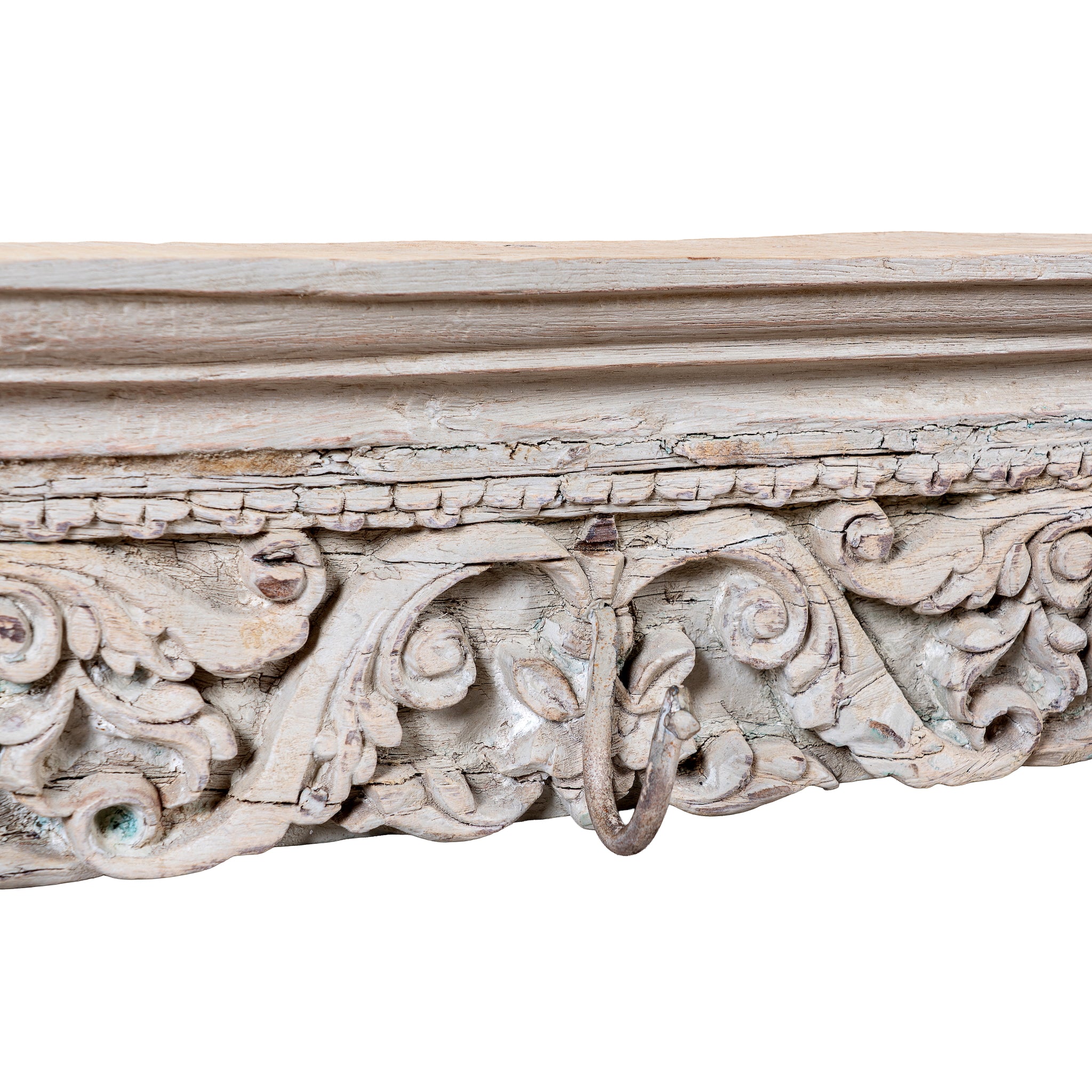 Close up image of a Raj Heritage Coat Rack handcrafted from an antique Indian reclaimed wood architectural element with intricate hand-carved floral details, bleached finish and seven iron hooks, 150x7x5cm.