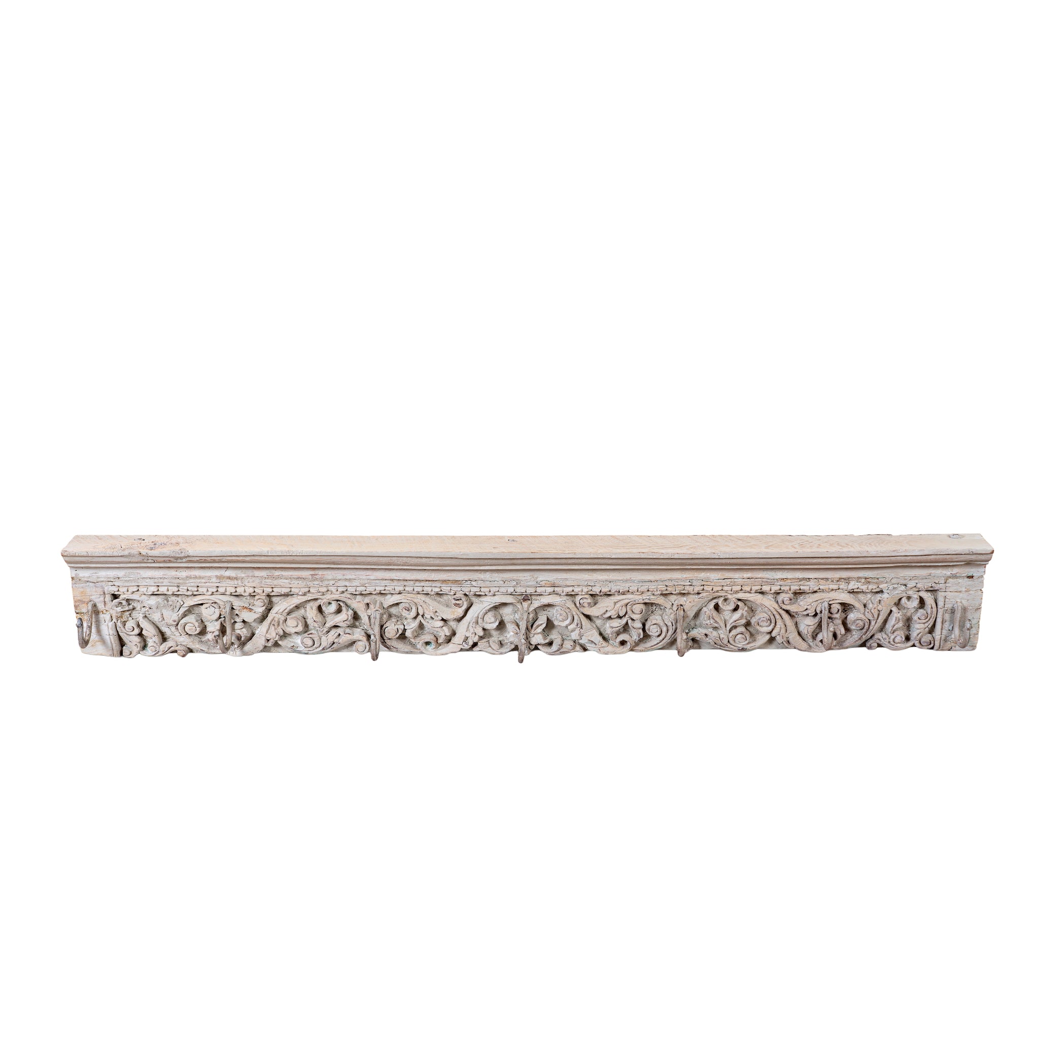 White background image of a of a Raj Heritage Coat Rack handcrafted from an antique Indian reclaimed wood architectural element with intricate hand-carved floral details, bleached finish and seven iron hooks, 150x7x5cm.