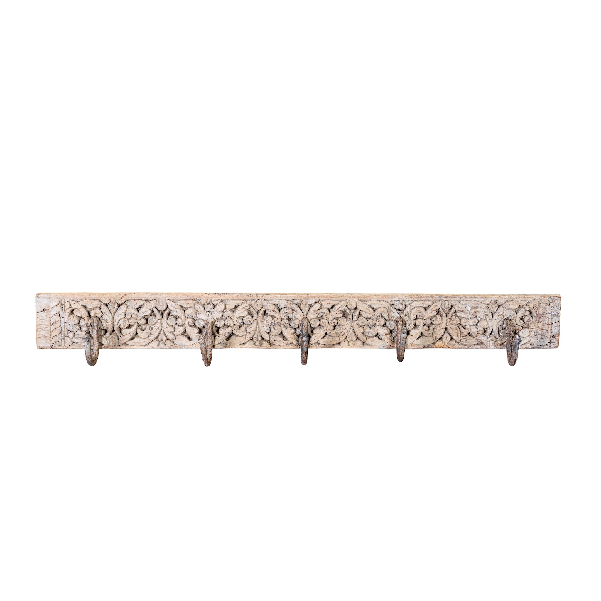 White background image of a hand-carved reclaimed wood wall hook rack crafted from an antique Indian architectural element with five iron hooks, intricate floral carvings, bleached finish, and vintage rustic character, 150cm.