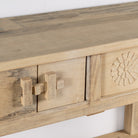 Close up image of a rustic reclaimed teak console table with hand-carved detailing and hidden side compartments; sustainable furniture, 170 × 82 × 48 cm.