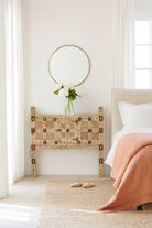 Lifestyle image of a sandblasted antique Indian teak chest with hand-carved details, original iron fittings, and a naturally aged finish, ideal for bohemian or vintage-inspired interiors.