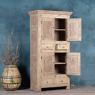 Open door image of a handcrafted wooden carved wardrobe with antique panel doors – teak wood furniture with rustic charm and traditional detailing.
