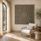 Lifestyle image of a hand-carved solid mango wood wall panel with floral and ornamental engravings in a soft distressed finish, ideal as wall décor or a bed panel.