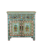 White background image of a hand painted green Indian cabinet made from recycled wood with floral motifs, 2 drawers and 2 compartments, 90 × 90 × 40 cm.