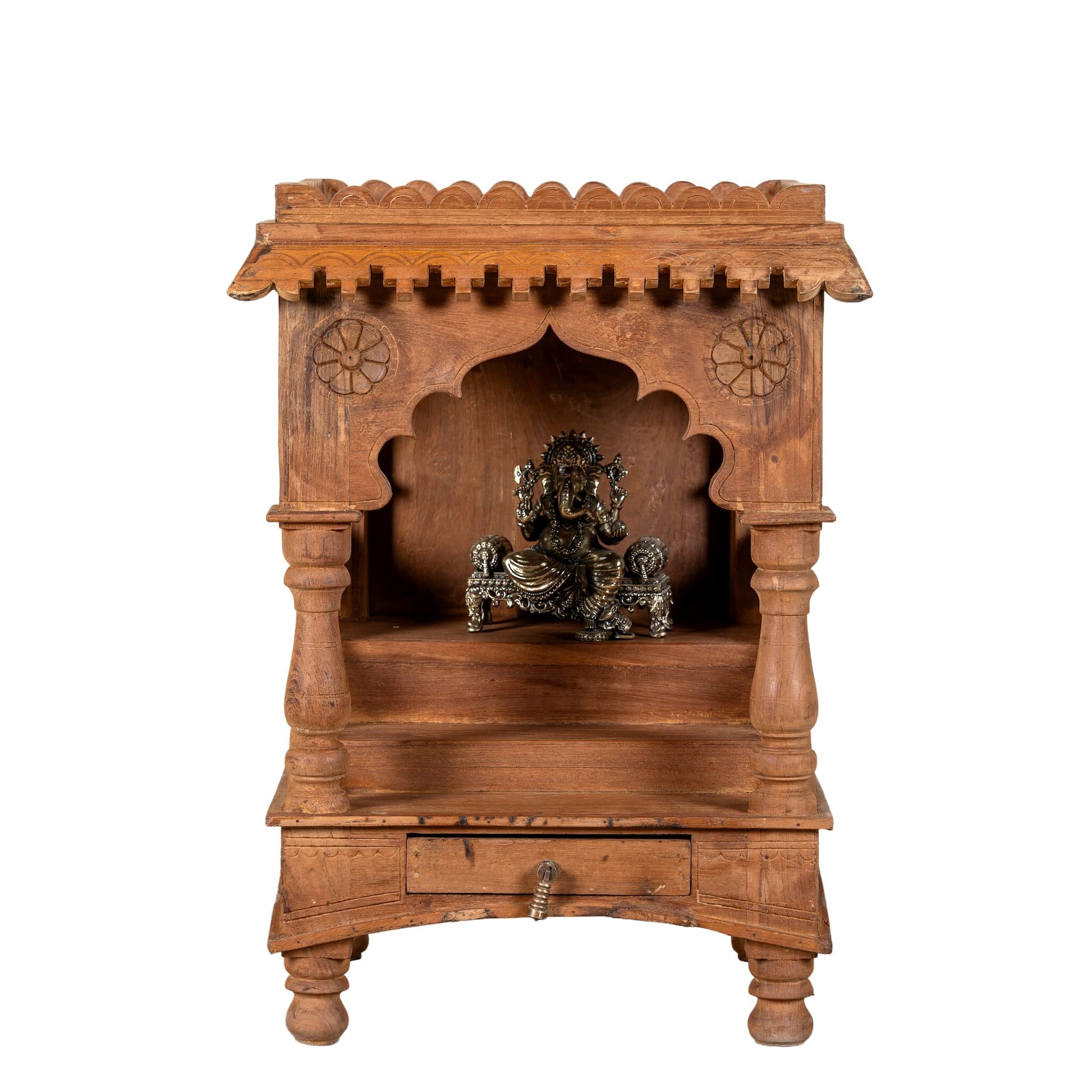 White background image of a handcrafted old teak wood home temple with carved details and drawer, ideal for religious items and Indian spiritual home accessories.