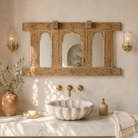 Lifestyle image of a Rishab hand carved reclaimed teak wood mirror made from an original Indian window frame with three arched mirror panels 122cm