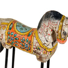 Hand-painted wooden horse sculptures on iron stands in assorted colours and designs. Unique Indian decor items, perfect for bohemian interiors and artisanal furniture displays.