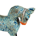 Close up image of a hand-painted wooden horse sculptures on iron stands in assorted colours and designs. Unique Indian decor items, perfect for bohemian interiors and artisanal furniture displays.