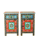 White background image of a hand-painted bedside table made from recycled wood – vintage night stands with carved mango wood furniture detailing and floral artistry.