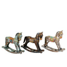 Colourful hand-painted wooden rocking horses with ornate saddle patterns, crafted in India. Unique bohemian interior décor accents made from solid wood, perfect for shelves or sideboards.