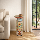 Lifestyle imagination of a hand‑painted wooden side table with floral motifs in vibrant colours, perfect for bohemian interiors and artisanal furniture displays.