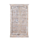 White background picture of a handcrafted carved wood wardrobe with whitewashed finish and arched teak doors – Ruchi by Om Home & Garden, vintage-inspired white washed furniture with artisanal detailing.