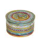 White background image of a hand-painted round wooden box with lid, featuring traditional Indian script and decorative motifs in red, blue, and black. A unique Indian decor item used for storage or display, available in four different designs.