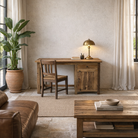 Lifestyle image of a rustic minimalist wooden desk made from reclaimed old wood with drawer and cabinet, 130 × 60 × 75 cm.