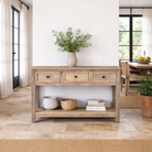Lifestyle image of a sandblasted reclaimed wood bathroom console table with 3 drawers and open shelf; sustainable furniture, 120 × 50 × 80 cm.