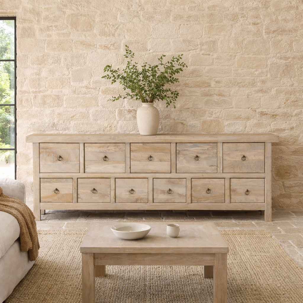 Lifestyle imagination of a reclaimed wood furniture chest of drawers with 11 drawers, Ibiza style living room furniture with sandblasted finish, 250 × 40 × 85 cm.