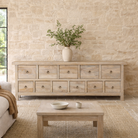 Lifestyle imagination of a reclaimed wood furniture chest of drawers with 11 drawers, Ibiza style living room furniture with sandblasted finish, 250 × 40 × 85 cm.