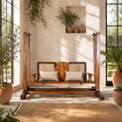 Lifestyle image of a Rutvi mango wood swing bench with stand, rattan backrests and folding coffee table, 237cm