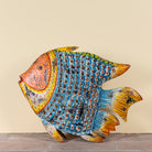 Saatvik hand painted freestanding metal fish sculpture with vibrant blue, orange and yellow detailing, handcrafted decorative home accessory, 107x15x80cm.