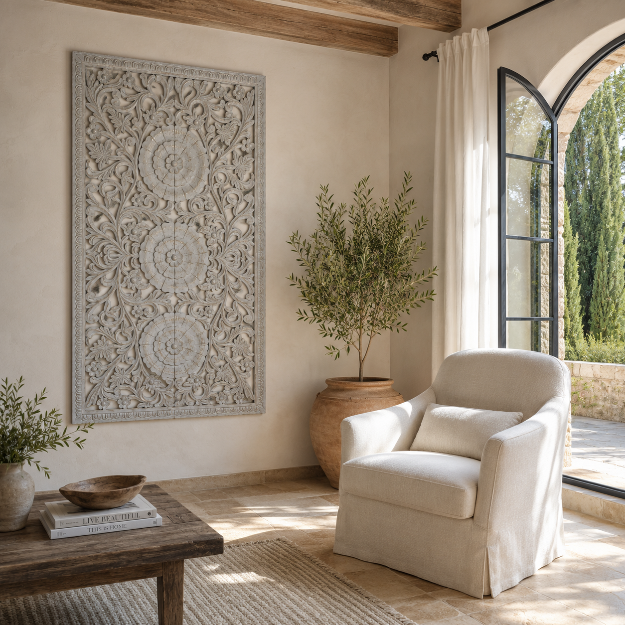 Lifestyle image of a hand-carved light grey mango wood wall panel with intricate floral openwork detailing, designed as elegant vertical wall décor with timeless artisan character.