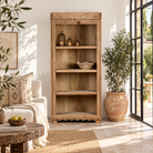 Lifestyle image of a Sagar hand carved reclaimed teak wood shelving made with an old teak door frame and four open compartments 180cm