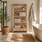 Lifestyle image of a Sahadev wide mango wood shelving unit with open shelves and two drawers 190cm