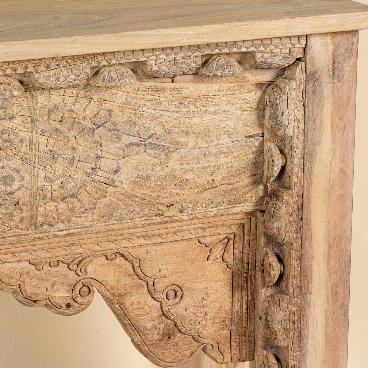 Close up image of a Saiyan reclaimed teak wood console table with hand-carved old Indian house elements and architectural front 140cm