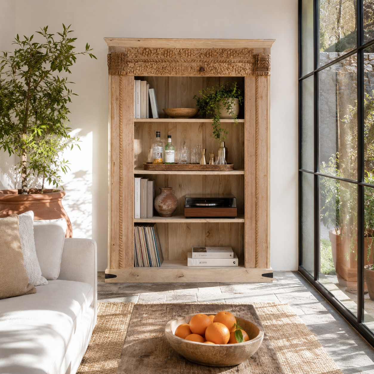 Lifestyle image of a handcrafted shelf with reclaimed teak wood frame and mango wood body – unique Indian furniture with carved detailing and rustic teak wood finish.