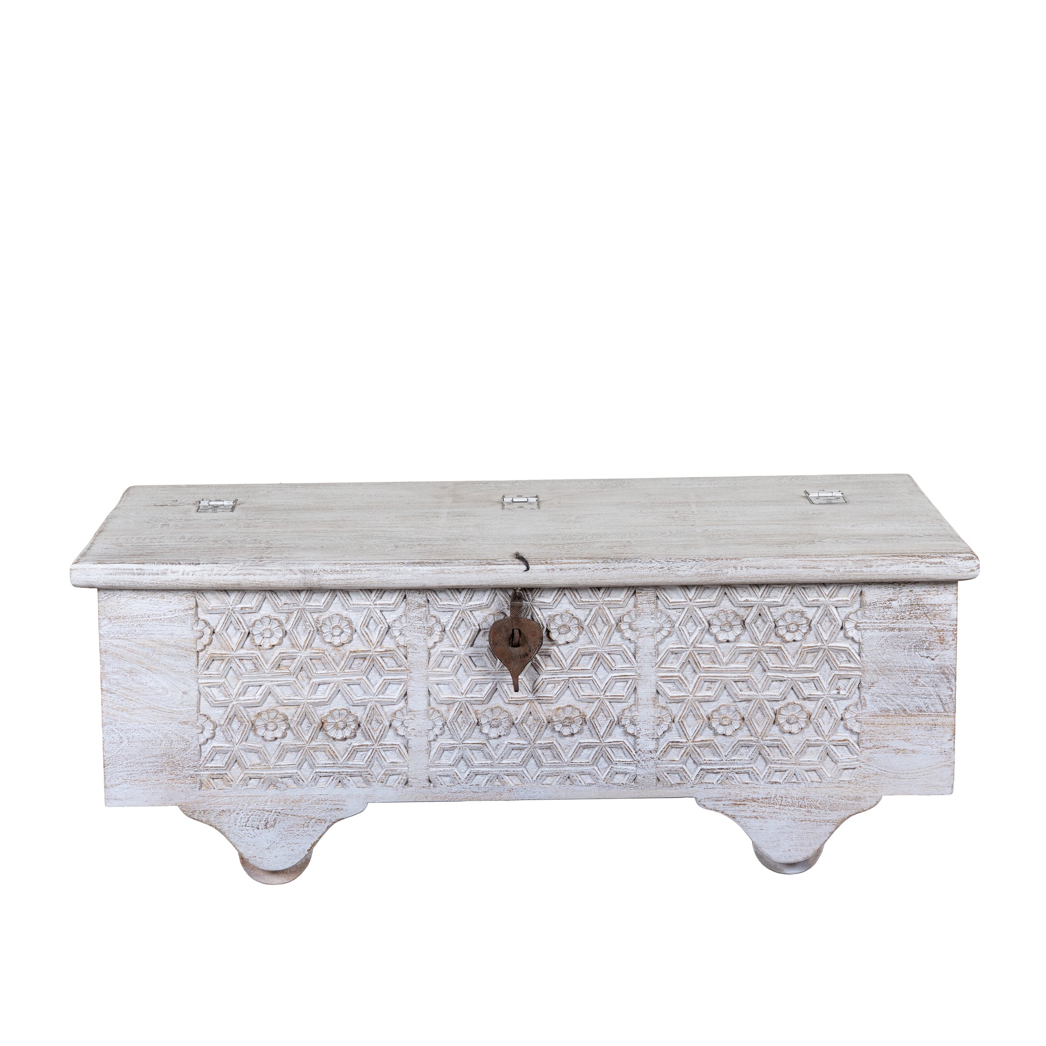 White background image of a Samay mango wood storage chest coffee table with carved geometric front, iron fittings, wooden wheels and distressed finish 120cm