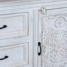 Close up image of a mediterranean-style carved sideboard in solid mango wood with floral motifs and elegant legs; ideal for vintage home decor, 150 × 90 × 40 cm.