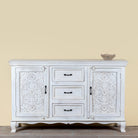 Mediterranean-style carved sideboard in solid mango wood with floral motifs and elegant legs; ideal for vintage home decor, 150 × 90 × 40 cm.