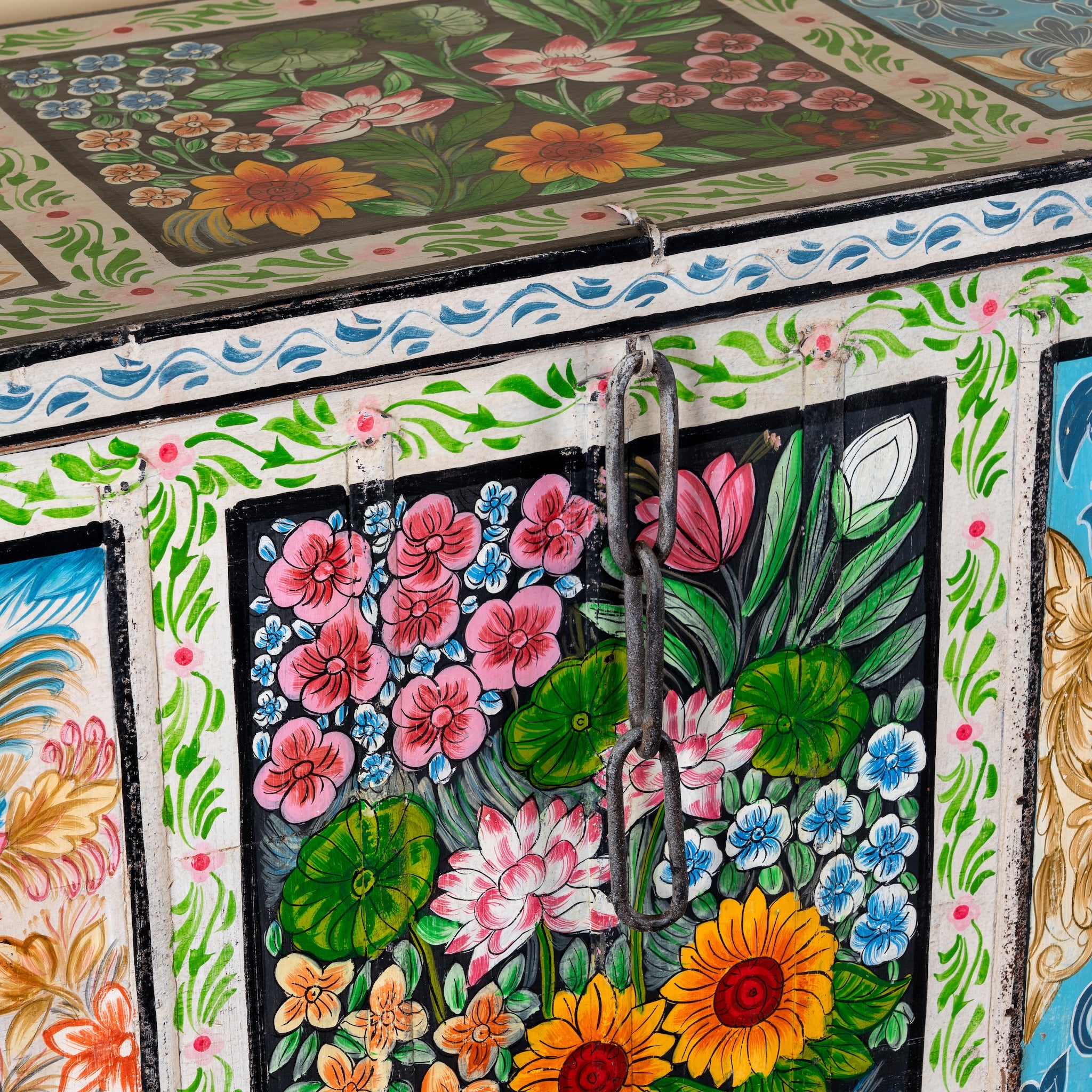 Close up image of a Sarina hand painted reclaimed wood storage chest with traditional Indian artwork 120cm
