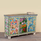 Side angle image of a Sarina hand painted reclaimed wood storage chest with traditional Indian artwork 120cm