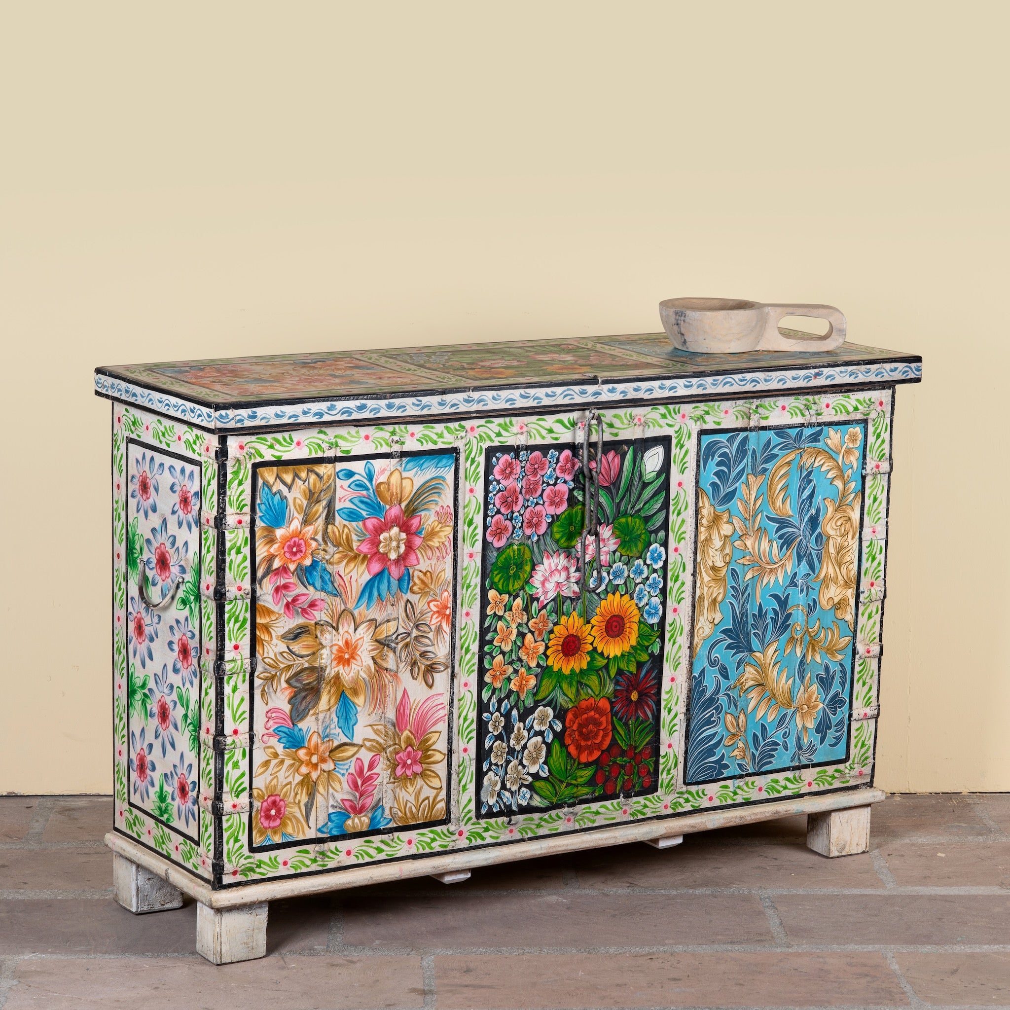 Side angle image of a Sarina hand painted reclaimed wood storage chest with traditional Indian artwork 120cm