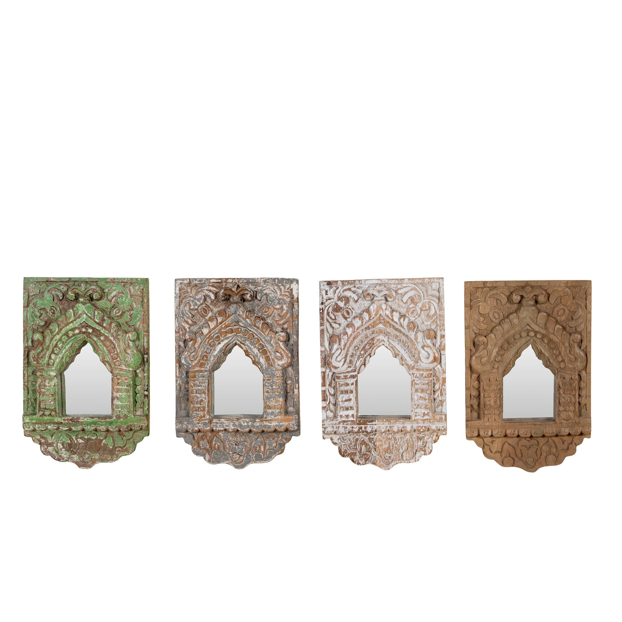 White background image of hand-carved wooden wall mirrors Sathvik with ornate jharokha arches and floral detailing, available in various vintage finishes. A unique Indian decoration and vintage home accessory perfect for vintage home decor settings.
