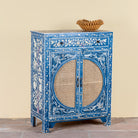 Side angle image of a Satya hand painted reclaimed wood cabinet with natural rattan doors 105cm