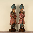 Side angle image of a Satyajit hand carved and hand painted reclaimed wood Rajasthani palace guard statues in traditional dress 153cm