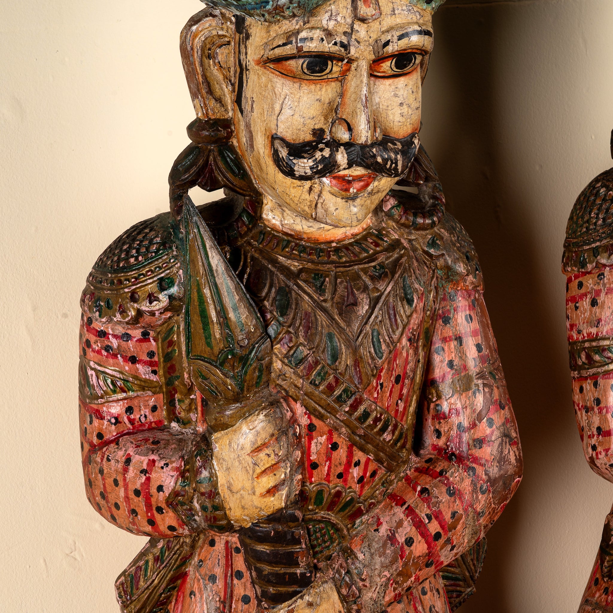 Close up image of a Satyajit hand carved and hand painted reclaimed wood Rajasthani palace guard statues in traditional dress 153cm