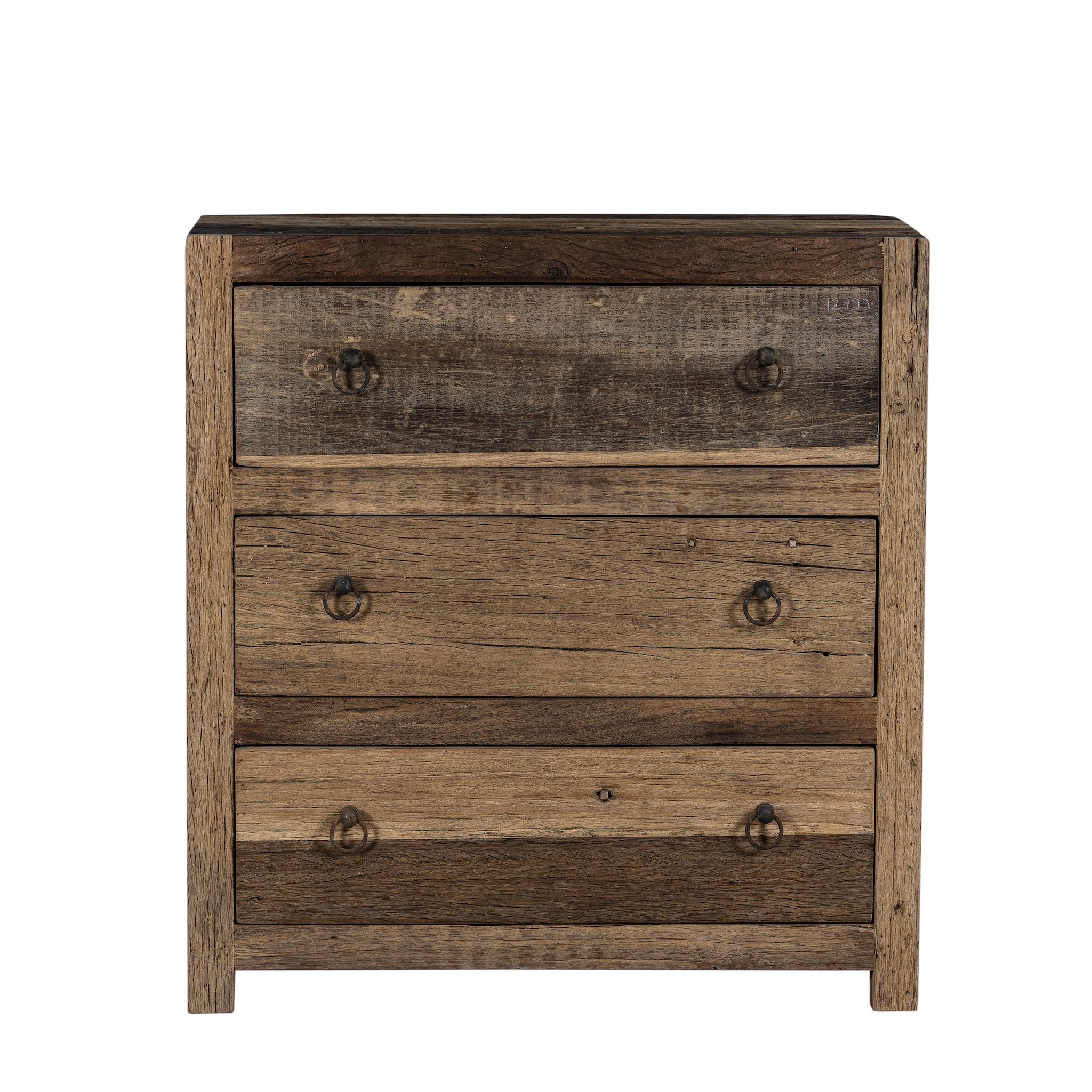 White background image of a three-drawer dresser in Driftwood/Wabi Sabi style made from recycled old wood, featuring a naturally weathered finish with visible grain patterns and metal ring pull handles for a rustic, handcrafted look.

