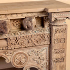 Close up image of a Sayon large carved reclaimed teak console table with antique Indian house elements and lower shelf, 216x54x92cm