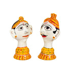 Side angle image of a set of 2 hand-painted Rajasthani papier maché heads featuring a man and woman in traditional attire, ideal for vintage home decoration and Indian home decor.